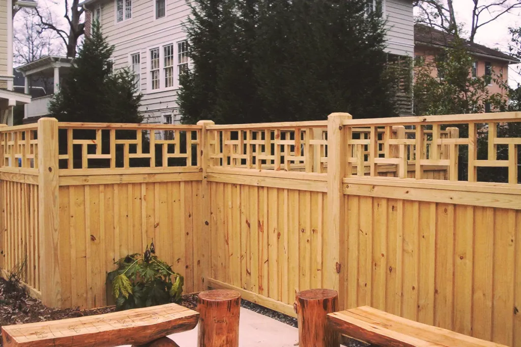 Wood privacy fence with a decorative lattice top